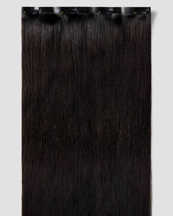 Clip-in hair extensions in black, designed to blend naturally with black hair for added volume and length.