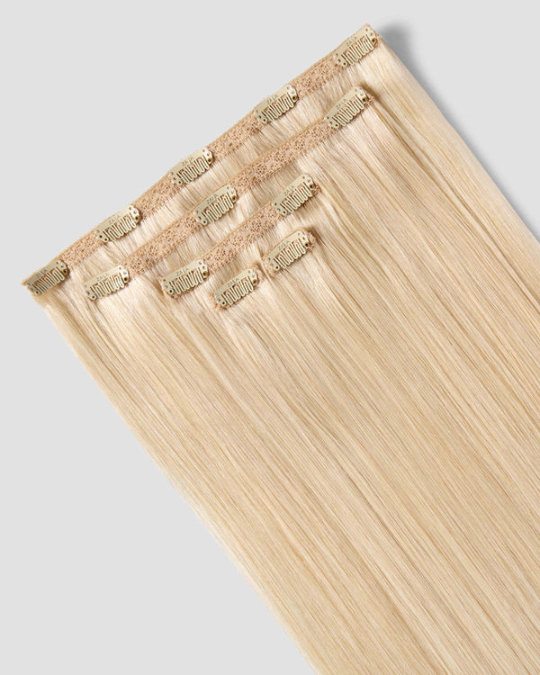 A clip-in hair extension in beachy blonde, showcasing a vibrant and stylish look for effortless hair enhancement.