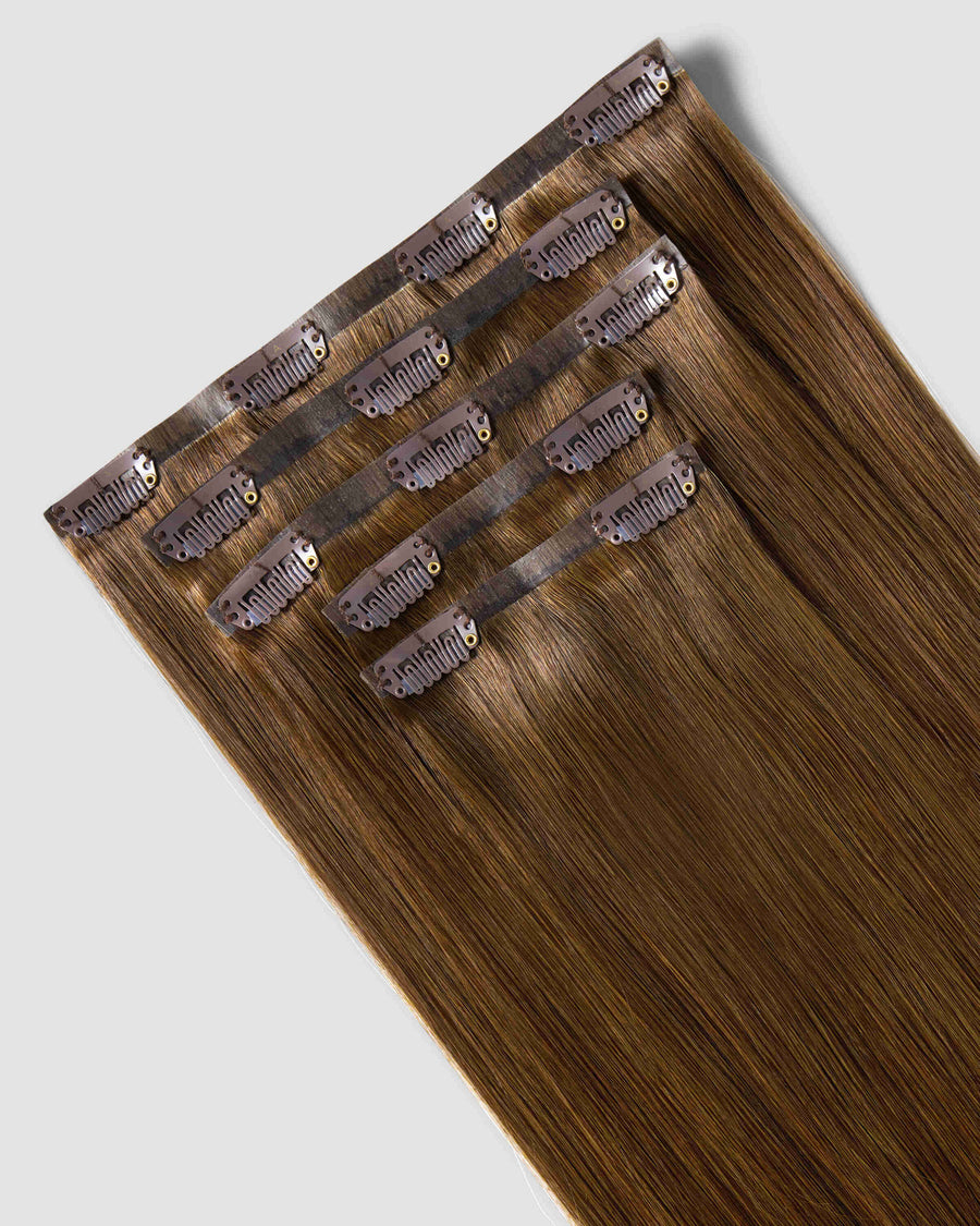Clip-in hair extensions in chestnut brown, showcasing a natural look for added volume and length.