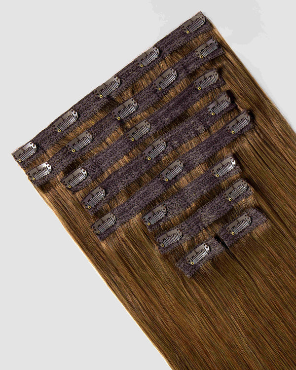 Clip-in hair extensions in chestnut brown, showcasing the clips and a rich, natural hue for added volume and length.