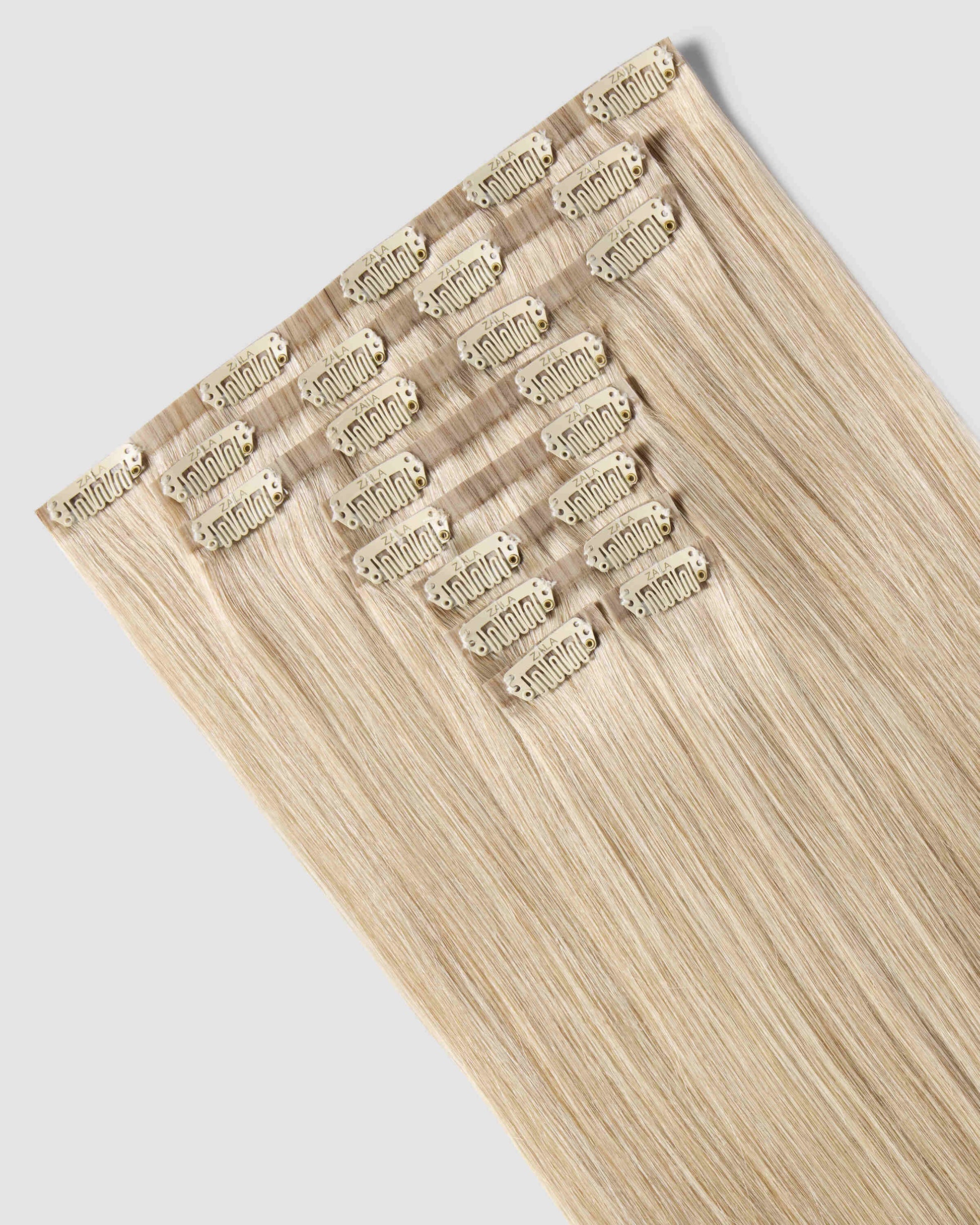 A set of clip-in champagne blonde hair extensions, highlighting their luxurious texture and natural appearance.