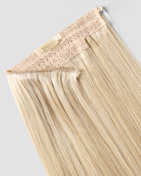 A champagne blonde halo hair extension with a lace closure, designed for a flawless and natural appearance.