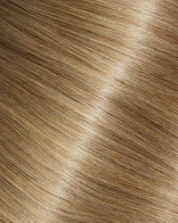A swatch of mocha swirl hair extensions featuring long, wavy strands, showcasing their texture and shine.