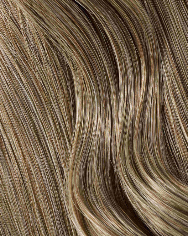 A hair extension swatch of top deck brown colored hair extensions.