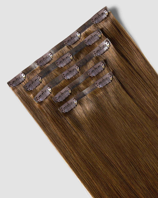 Clip-in hair extensions in chestnut brown, showcasing a natural look for added volume and length.