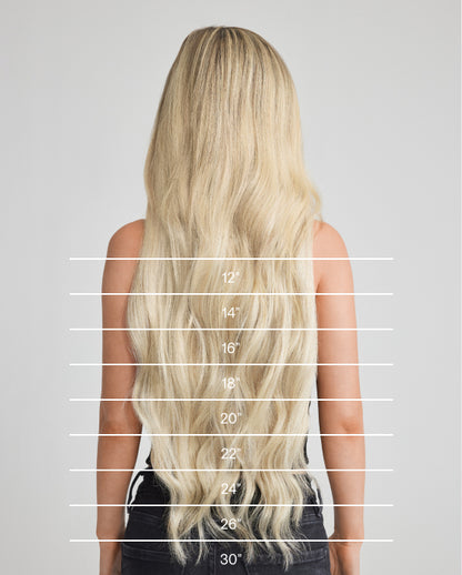 A chart illustrating the length of Champagne Blonde hair extensions on a woman's hair.