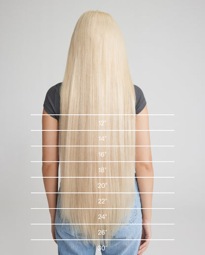 An image depicting a hair extension chart showcasing the varying lengths of a woman's hair for styling options.