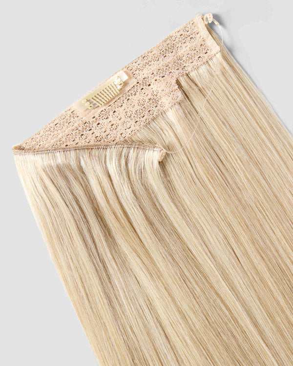 A champagne blonde hair extension with a lace closure, designed for a flawless and natural appearance.