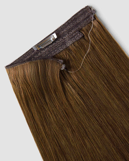 A close-up of Halo Chestnut Brown hair extensions showcasing long, flowing brown hair with a rich, lustrous texture.