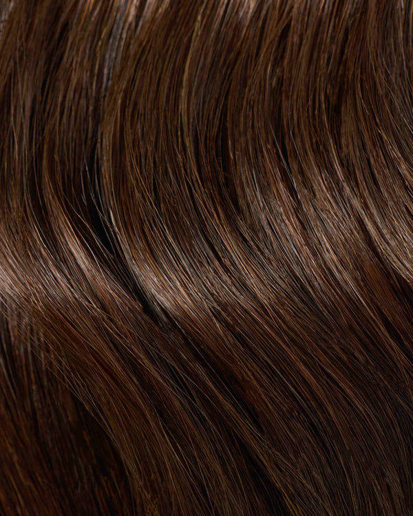 A swatch of a dark chocolate hair extension for a rich, vibrant look.