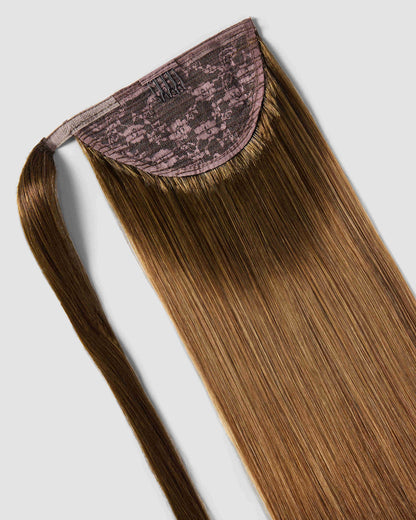 Clip-in ponytail extension in chestnut brown, crafted from synthetic hair for a natural look and easy application.