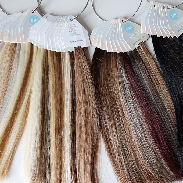 Four swatch rings of Zala Premium Hair Extensions featuring a label showcasing various colors available for purchase.